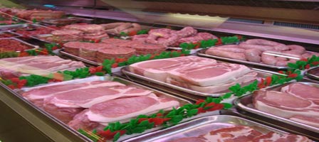 Counter display showing bacon, burgers and sausage